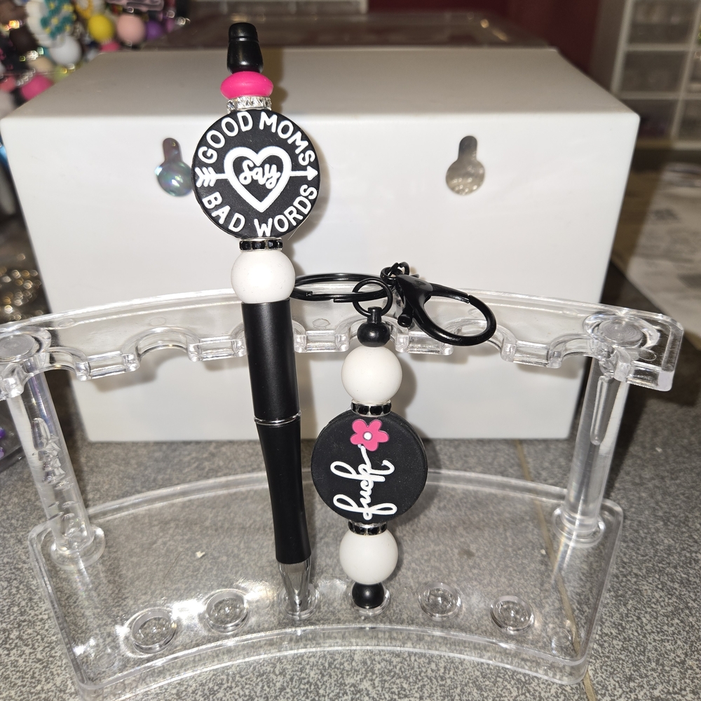 Stylish Black and White Pen and Keychain Set with Pink Accents